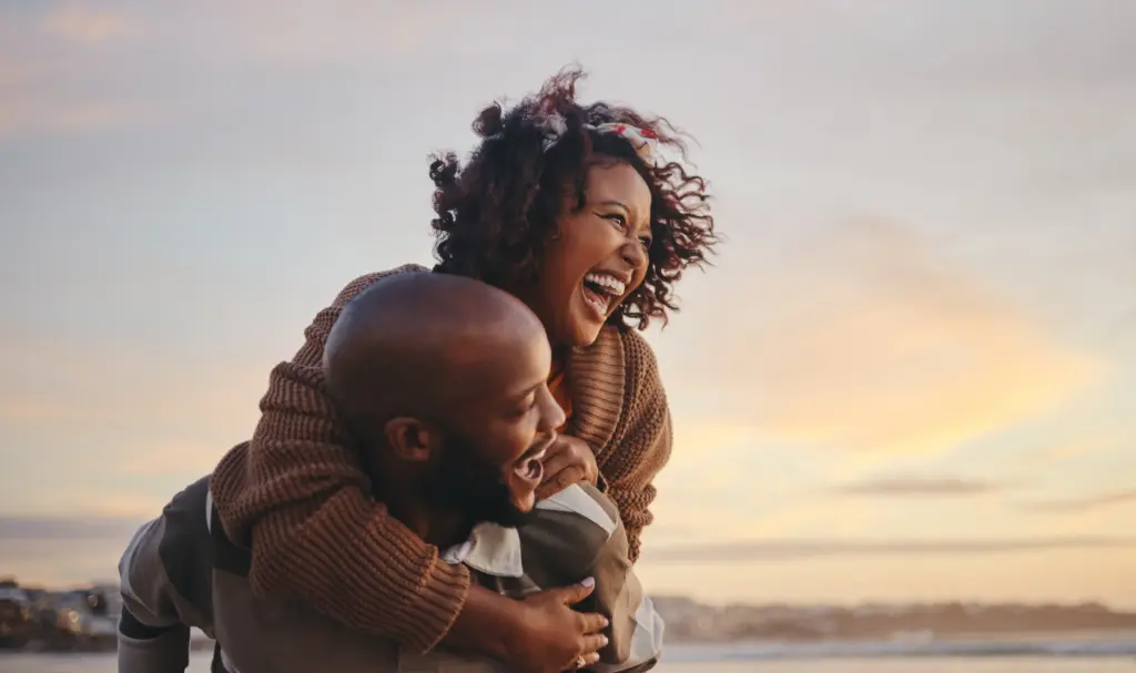 Happy couple enjoying life with bright healthy smiles